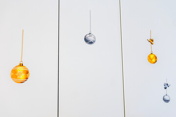 Close up view of white kitchen cabinet doors decorated with festive Christmas stickers inside villa interior. Sweden.