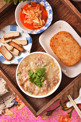 Brown rice porridge served with side dish on the table. 