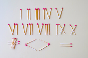 Pile of Wooden unused match stick in Roman numerals.