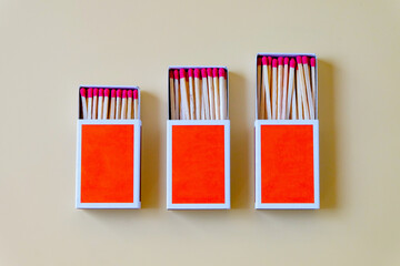 Pile of Wooden unused match stick in red box over the color background.