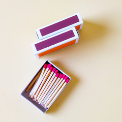 Pile of Wooden unused match stick in red box over the color background.