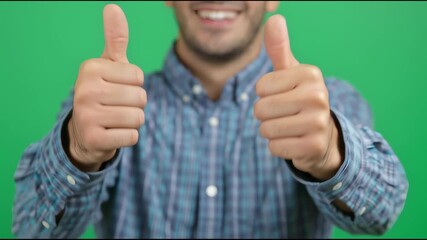Man Showing Double Thumbs Up Gesture on Green Screen Background