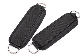 pair of black kickback ankle straps for kickback machine isolated on white background, gym booty workout, fitness lifting weights, gym equipment