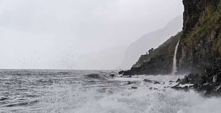 Stormy coastal scene, Majestic cliffside battered by relentless stormy sea waves