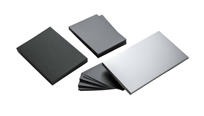 Several stacks of rectangular, matte-finish cards of various shades of gray, on black