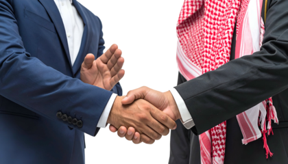 Two men in business attire shake hands, one wearing traditional Arab headwear