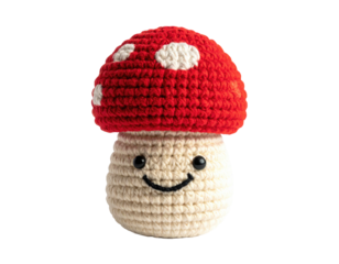 Crocheted red mushroom toy with smiley face