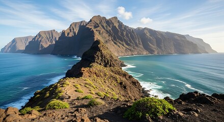 Majestic coastal mountain range overlooking the vast ocean waters.