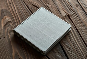 Gray recycled notebook rests on rustic wood grain, item, recycled paper