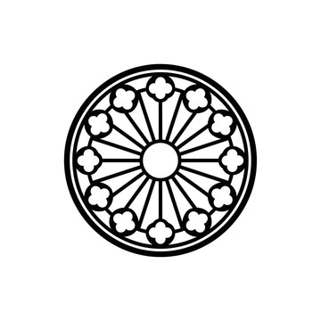Black circular ornamental window with radiating spokes and floral motifs.