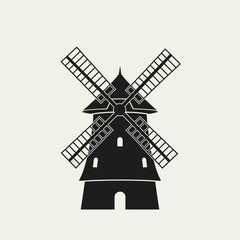 Obraz premium Silhouette of a traditional windmill with four sails.