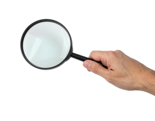Magnifier held by a hand on a black background