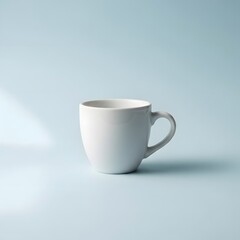 Obraz premium A white coffee mug on a light blue background