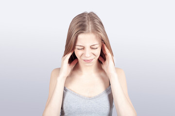A girl rubbing neck - neck pain and osteochondrosis concept