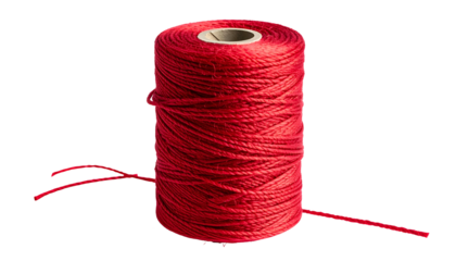 A vibrant spool of red thread with a paper core against a stark black background