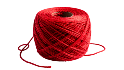 A vibrant, close-up view of a large, full spool of red thread against a black backdrop