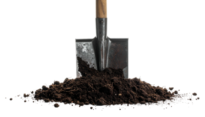 A metal shovel stands upright, partially buried in a mound of dark, rich soil, black background