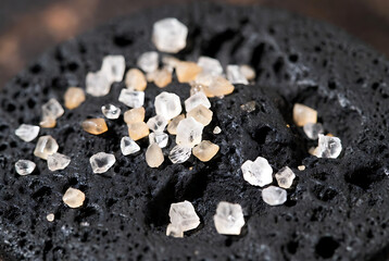 Sea Salt Crystals on Dark Stone Background