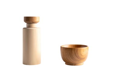 Still life featuring a slender, light wooden bottle with a cap, next to a small wooden bowl, set against a stark black backdrop