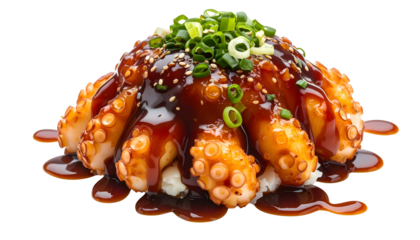 Cooked octopus tentacles on rice, drizzled with sauce and sprinkled with herbs and sesame