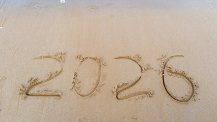 Year 2026 Written in Sand on Beach