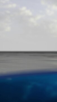 calm blue sea with underwater depth and cloudy horizon, splitlevel composition showing surface ripple and deep teal undercurrent cool grey sky, subtle