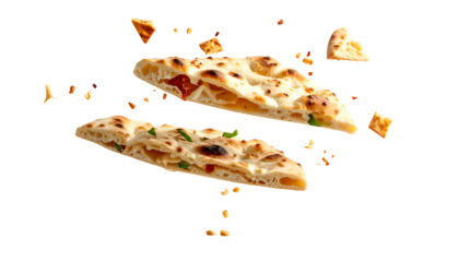 Two slices of bread, filled, floating against a black backdrop, with scattered pieces