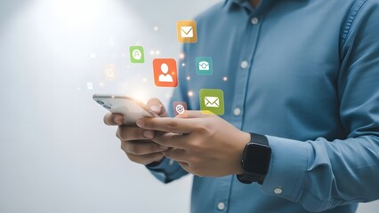 Man interacting with mobile phone and social media icons