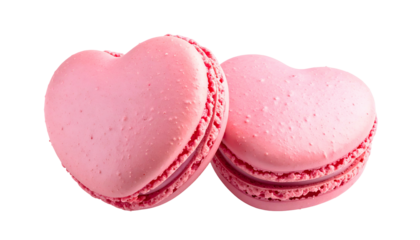 Two delicate pink heart-shaped cookies with creamy filling, isolated on a transparent background