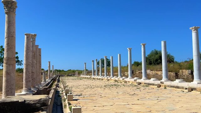 SIDE, TURKEY, June 16, 2024: Ruins of the ancient city of Side in Antalya province on the Mediterranean coast. Amazing ruins of an ancient city. Old statues in the State Agora.The ancient city wall.4K