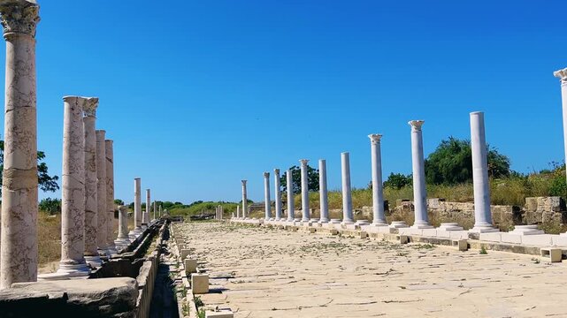 SIDE, TURKEY, June 16, 2024: Ruins of the ancient city of Side in Antalya province on the Mediterranean coast. Amazing ruins of an ancient city. Old statues in the State Agora.The ancient city wall.4K