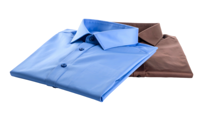 Two folded dress shirts, one blue and one brown, neatly arranged with isolated black background