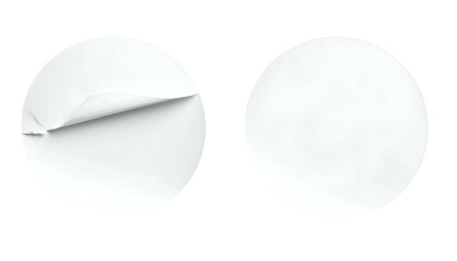 Two white circular stickers, one partially peeled, against a black background