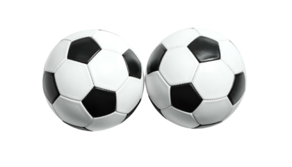 Two regulation soccer balls side by side against a stark black background