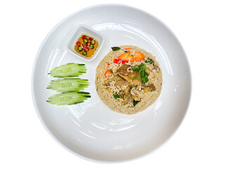 Thai-style fried rice with crispy snakeskin gourami, served on a white plate with cucumber and a small bowl of chili fish sauce, isolated on a transparent background.