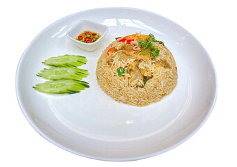 Thai-style fried rice with crispy snakeskin gourami, served on a white plate with cucumber and a small bowl of chili fish sauce, isolated on a transparent background.