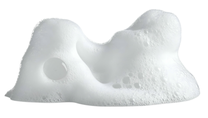 Close-up of frothy white bubbles, appearing smooth and textured against a black backdrop