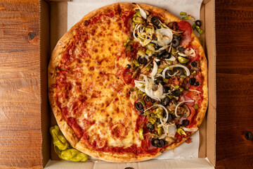 Half plain pizza and half with onions and olives