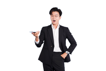 Startled Businessman with Smartphone: A sharply dressed businessman stands with an open-mouthed expression of surprise, holding a sleek smartphone, communicating a mix of shock and modern tech