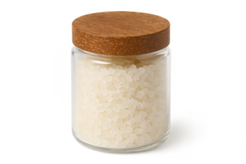 Bath salt granules in glass jar with wooden lid