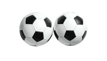 Two soccer balls with a classic black and white pentagonal design, isolated on black
