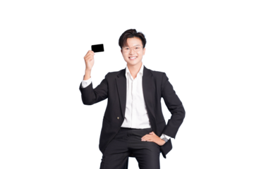 Man Showcasing Black Card: A confident man in a suit cheerfully holds up a sleek black card, embodying financial empowerment and ease. 