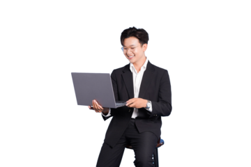 Businessman Engaged: A well-dressed business professional, beaming with satisfaction, intensely focused on a laptop.