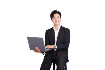 Focused Productivity: A sharp business professional sits poised with a laptop, the light of digital creation reflecting in his eyes, his crisp attire and serene focus, an emblem of modern work