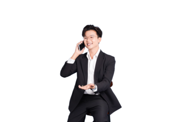 Business Communication: A poised individual, suited in formal attire, engages in a phone conversation, exuding professionalism and a friendly demeanor.