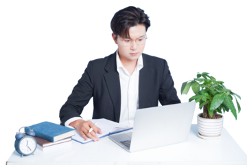 Focused Professional at Work: An absorbed professional meticulously works on a laptop at a desk, surrounded by office tools, symbolizing productivity and dedication. 