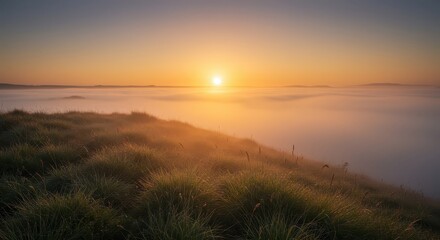 Obraz premium Bright sun ascends above a blanket of thick mist settled in a valley landscape