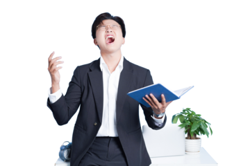 Frustrated Business Man: A focused business professional dressed in a formal suit. He is expressing his stress, holding a notebook, and sitting on a desk in the office setting.