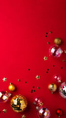 Christmas ornaments on a red background.