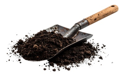 Close-up of a gardening trowel filled with dark, rich soil, resting on a black background